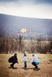 © Halfpoint - Happy family with kite