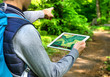 Man hiking with Tablet PC and GPS App – Wandern mit Wander App