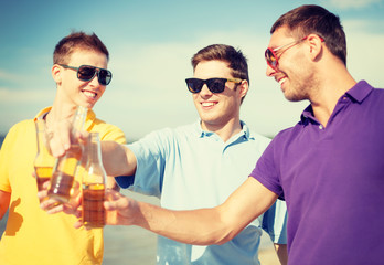 Poster - group of male friends having fun on the beach