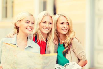 Wall Mural - beautiful women with tourist map in the city