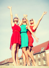 Wall Mural - three beautiful women in the city