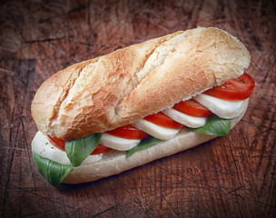 Wall Mural - Mozzarella cheese with tomato on a baguette