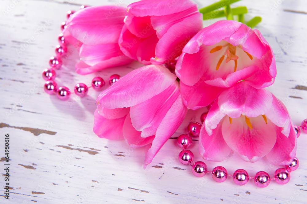 Beautiful tulips in bucket on table close-up