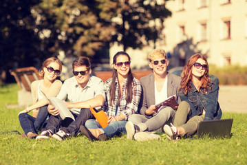 Canvas Print - students or teenagers with laptop computers