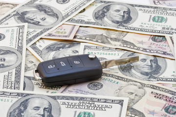 Wall Mural - Car keys over dollar banknotes