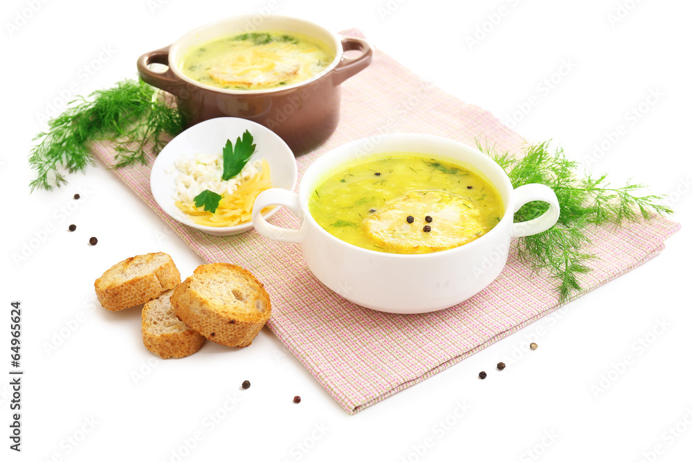 Tasty soup in saucepans, isolated on white