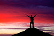 © es0lex - Silhouette of a man on a mountain top. Person silhouette on the