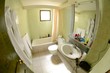 Hotel bathroom with appliance and cosmetic equipment.