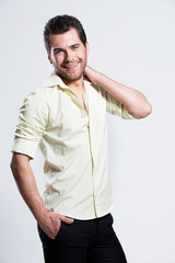 Wall Mural - Portrait of happy man in yellow shirt.