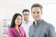 © jackfrog - Portrait of a smiling senior businessman in the foreground