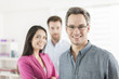 © jackfrog - Portrait of a smiling senior businessman in the foreground