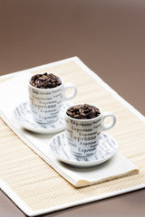 coffee cups full of coffee beans