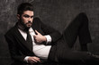 © Viorel Sima - young bearded business man pulling his collar