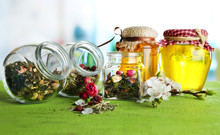Assortment Of Herbs And Tea In Glass Jars