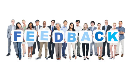 Wall Mural - Multiethnic Business People Holding the Word Feedback
