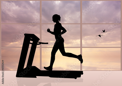 Fototapeta do kuchni woman runs on a treadmill