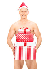 Canvas Print - Handsome naked man holding a stack of presents