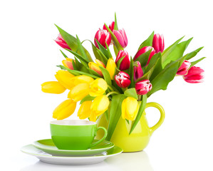 Wall Mural - yellow tulips flowers with cup tea, on a white background. break