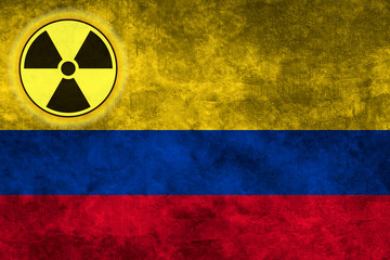 Wall Mural - Grunge flag background with nuclear sign - Colombia