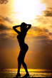 Portrait of woman as silhouette with sunset