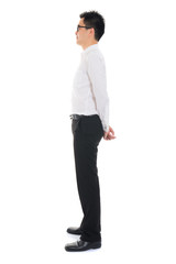 Wall Mural - Young Asian business man full body side view isolated on white b