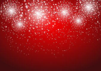 Starry fireworks on red background