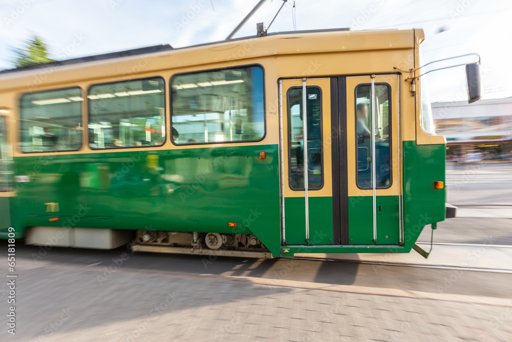 Tram Passing on the Road in Helsinki