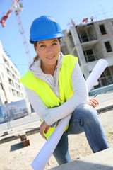 Portrait of woman engineer working on building site