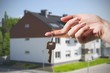 © Proxima Studio - Woman's hand holding keys to new house