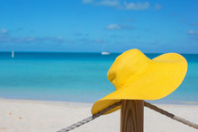 Yellow Hat On The Fence At Tropical White Beach