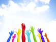 © Rawpixel.com - Colorful Hands Raised With Blue Sky