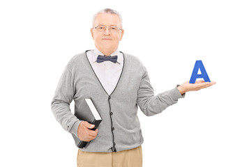 Poster - Male teacher holding book and the letter a