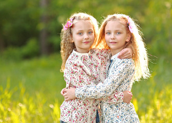 Portrait of two little girls twins