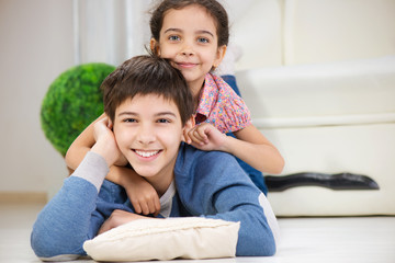 Wall Mural - Happy brother and cute little sister