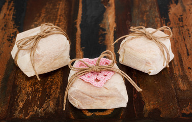 Three Brazilian wedding sweets bem casado on wooden table