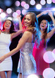 © Syda Productions - three smiling women dancing in the club
