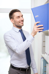 Sticker - handsome businessman picking folder at office