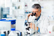 © lightpoet - senior male researcher carrying out scientific research in a lab