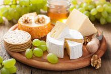 Cheese Plate With Camembert, Cheddar, Grapes And Honey