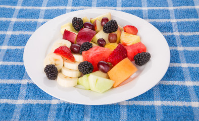 Wall Mural - Plate of Fresh Cut and Whole Fruit