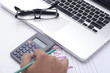 © patrisyu - typing on the calculator