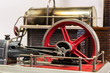 Close up of the flywheel of a steam engine