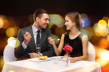 Poster - smiling couple eating dessert at restaurant