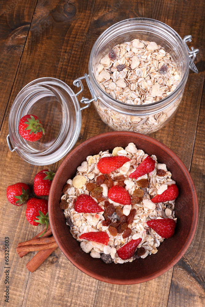 Healthy cereal with strawberry on wooden table