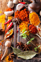 Wall Mural - Various spices on wood