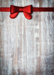 decorative ribbon and bow on a background of rustic boards