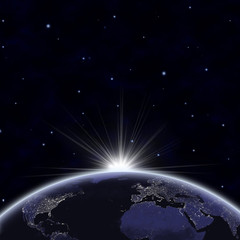 Wall Mural - planet earth with appearing sunlight. visible city lights.