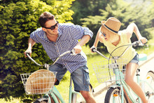 Happy Couple Riding Bikes