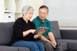 © leungchopan - Asia old couple using tablet