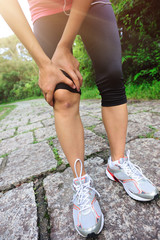 Poster - woman runner hold her sports injured knee